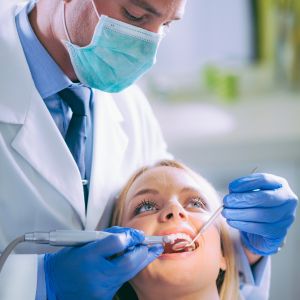 Calm Dentist Working on a patient