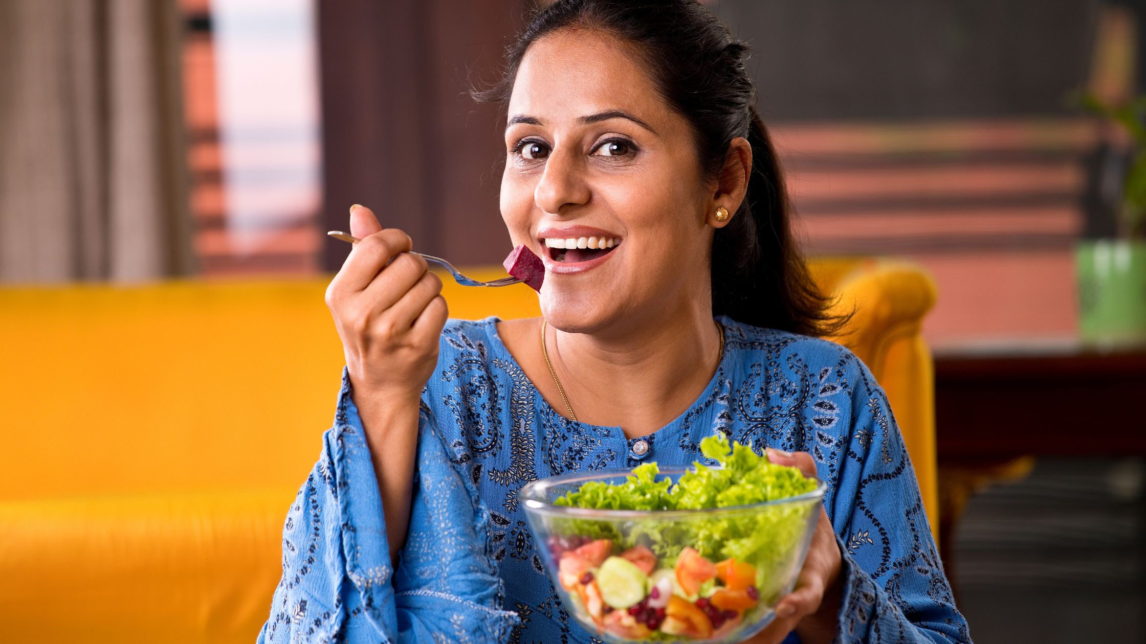 Nutrition and Oral Health - Woman eating salad