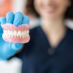 Restorative Dentistry - Dentist holding Dentures