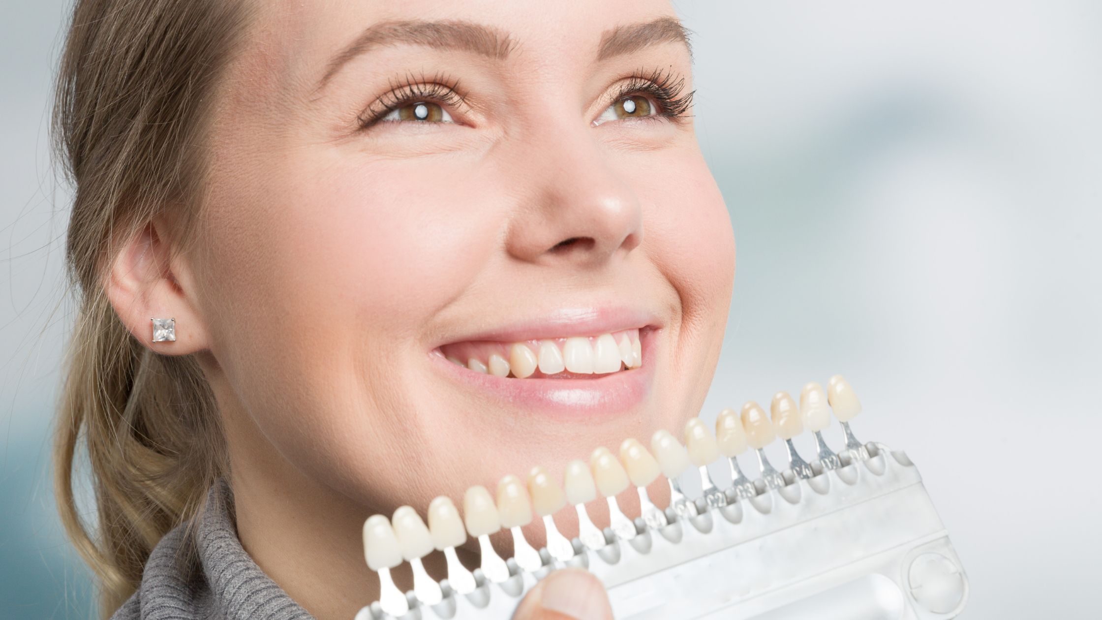 Porcelain Veneers - Matching Tooth Color to Female Patient