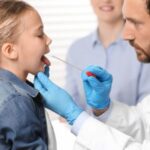 Oral Biome Testing - Dentist Swabbing Young Girl